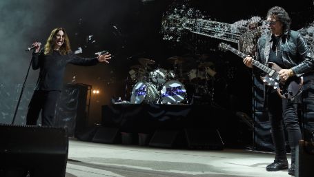 tony playing the guitar and ozzy singing 